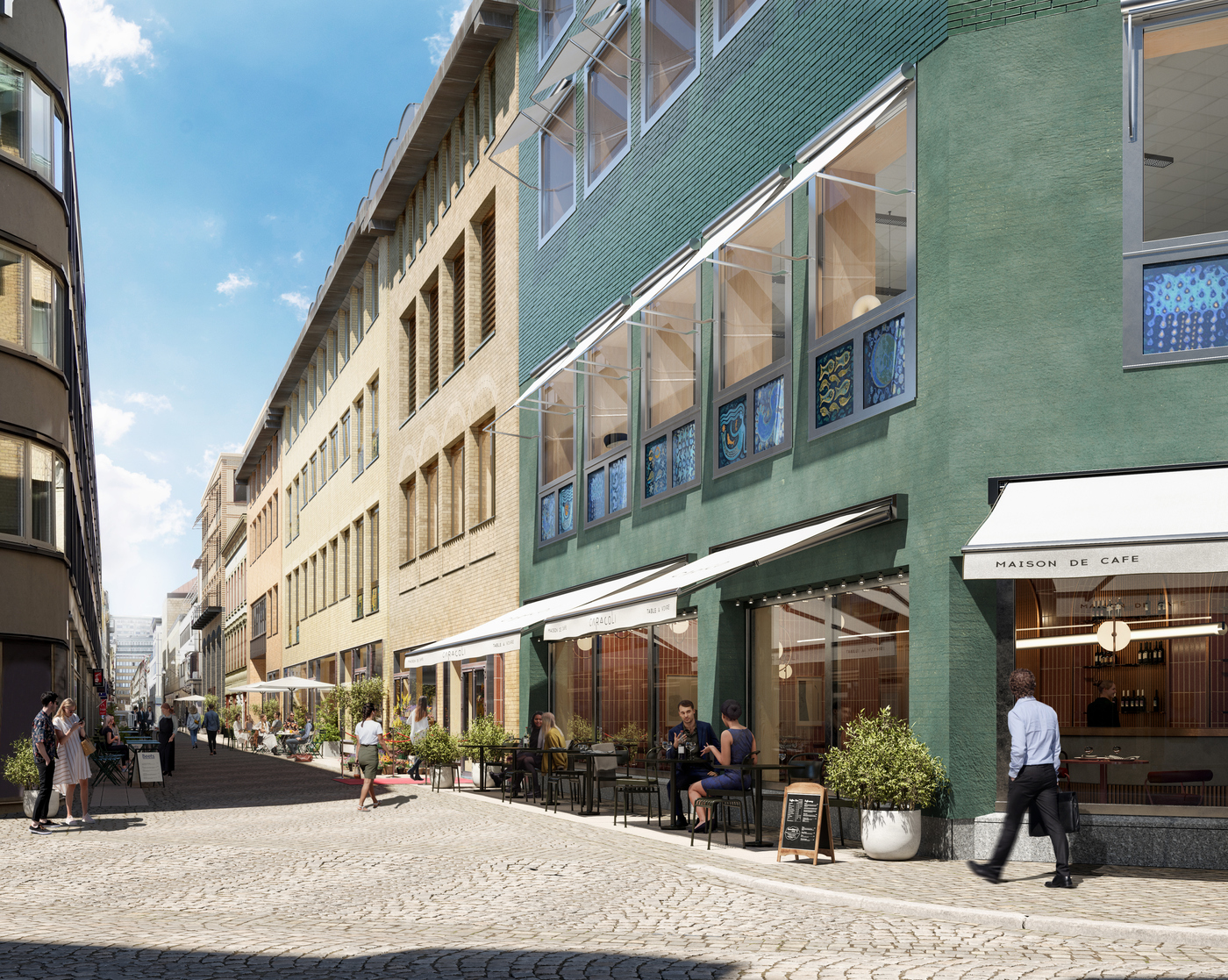 Vy från Östra Larmgatan med blick in mot folklivet på Drottninggatan.
