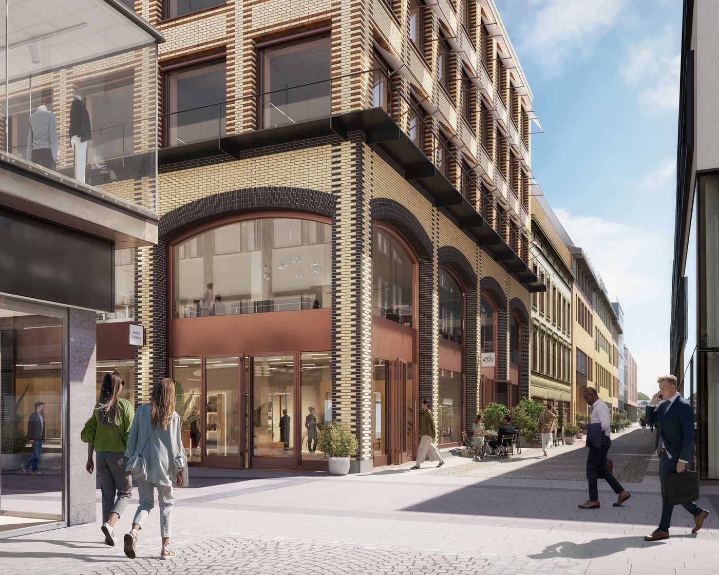 Korsningen Fredsgatan och Drottninggatan: I denna korsning uppförs en ny byggnad som flirtar med gammal göteborgsk arkitekttradition. En flerfärgad tegelbyggnad som tar för sig och blir ett vitaliserande tillskott till Fredsgatan. En utmärkande del i arkitekturen blir de stora välvda bågarna som kommer rama in butikslokalerna i bottenvåningen.